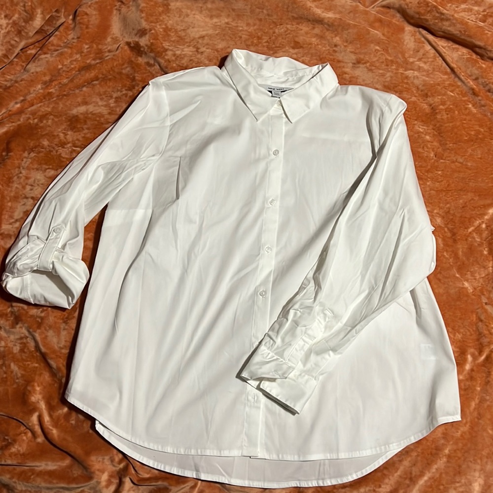 Women’s white button down blouse.